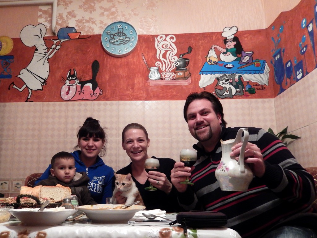 Us with Olga, Kyriel, Sonja, and our daily dose of homemade wine. Olga painted all the characters on the kitchen walls! 